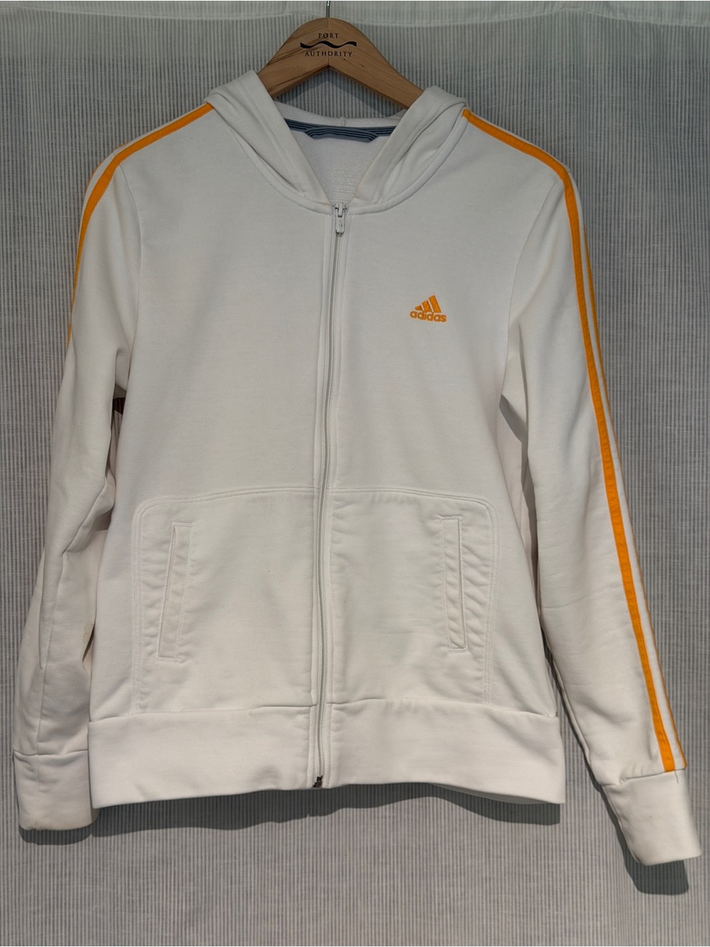 adidas women’s White Zip Hoodie with yellow-orange stripes